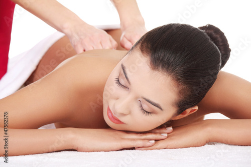 Young woman relaxing beeing massaged