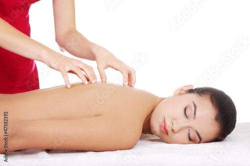 Young woman relaxing beeing massaged
