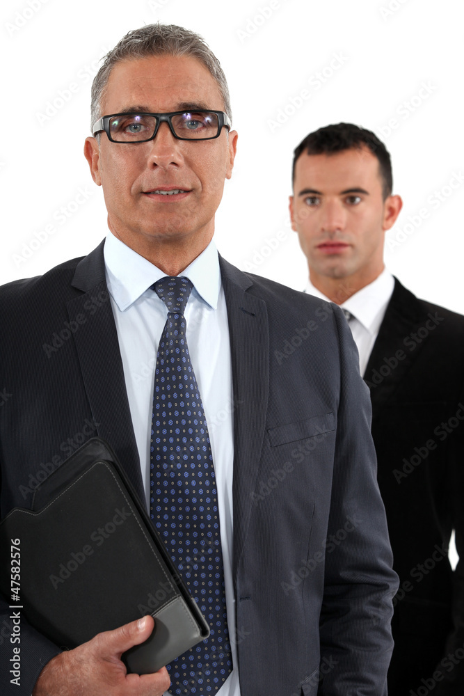 Businessman with young apprentice Businessman with young apprentice