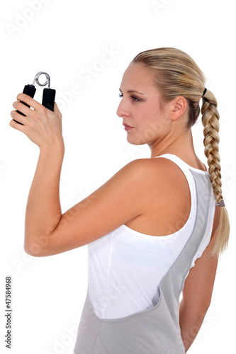 Woman doing wrist exercises