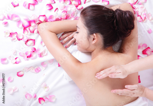 young woman getting massage and spa