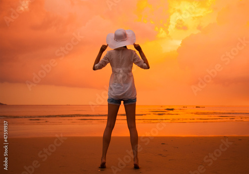 Sexy girl on the beach during sunset