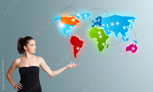 Young woman presenting colorful world map photo