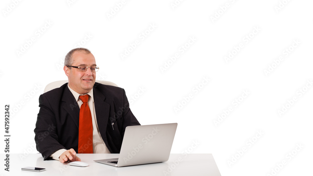 buisnessman sitting at desk and looking laptop with copy space buisnessman sitting at desk and looking laptop with copy space