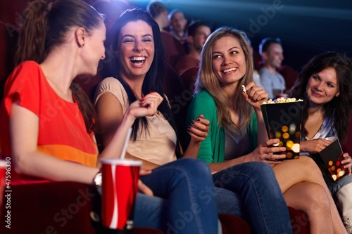 Happy girls in multiplex movie theater