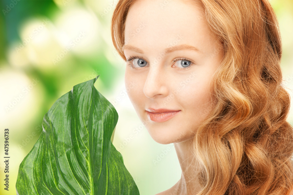 Naklejka premium woman with green leaf
