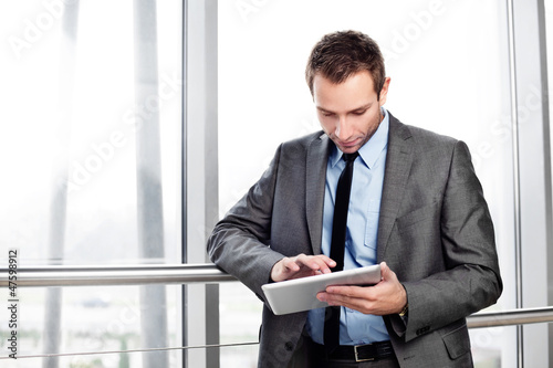 Businessman working on digital tablet