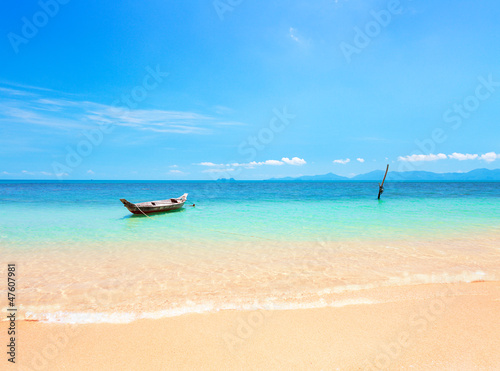 tropical beach and longtail boat