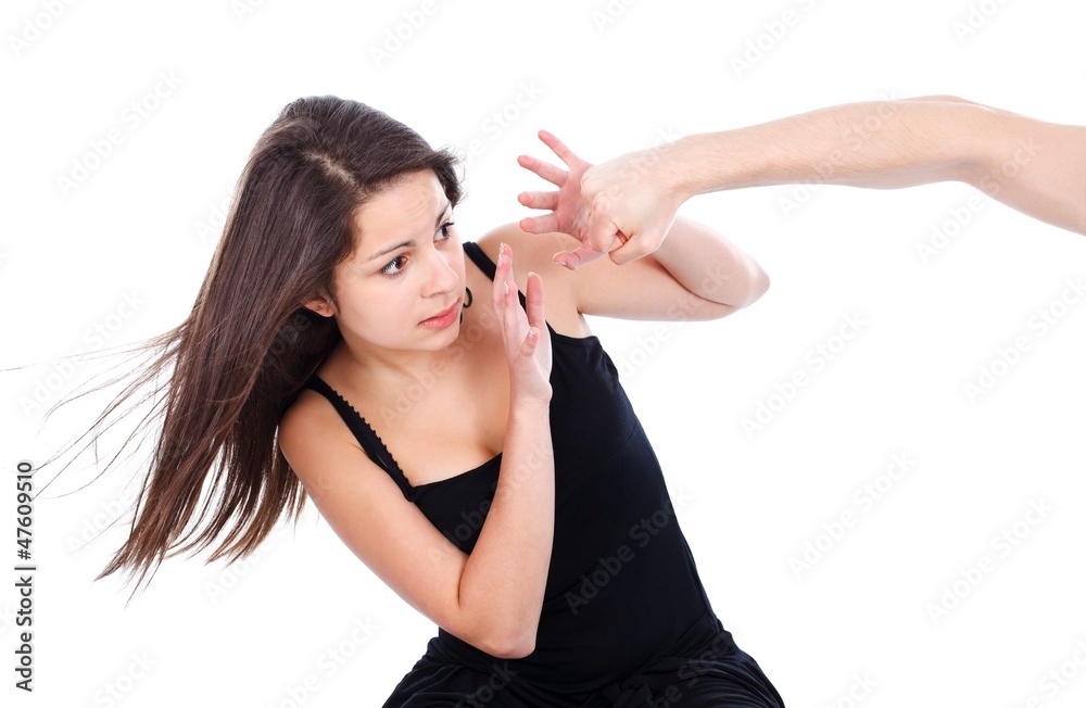 Teenage girl afraid of a hand hitting her Teenage girl afraid of a hand hitting her