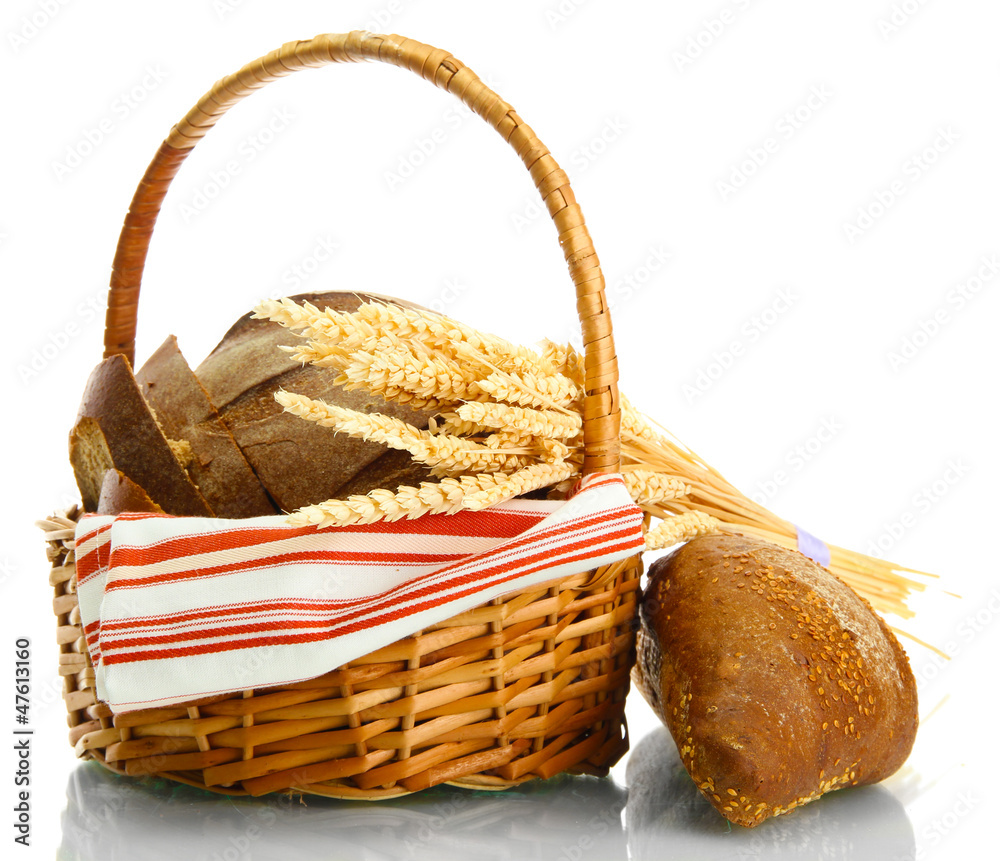 tasty rye breads with ears in basket, isolated on white