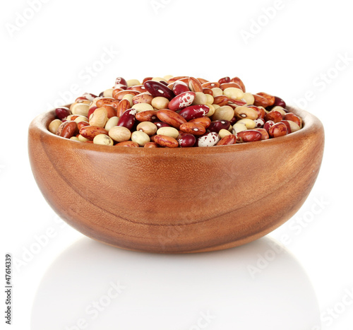 Wooden bowl with beans isolated on white