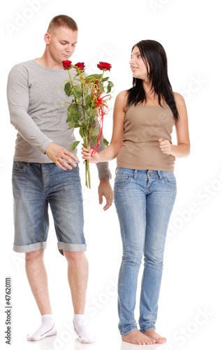 Attractive young couple gift rose in hand isolated