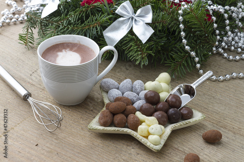 Cocoa cup with beater & chocolates on paddle