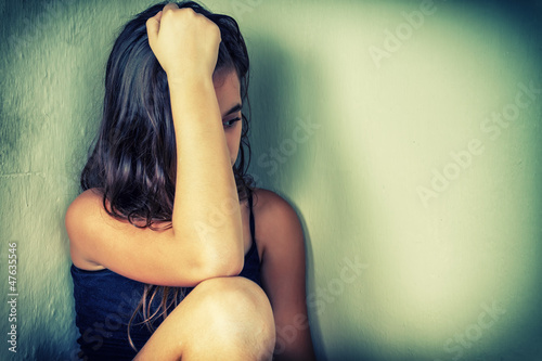 Photography Bleached vintage portrait of a sad and lonely teenager