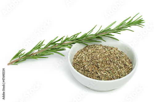 Fresh rosemary and a bowl with dried