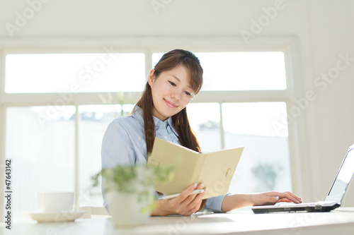 Beautiful asian businesswoman using a laptop computer