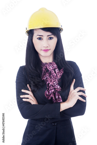 Beautiful woman engineer standing isolated over white photo