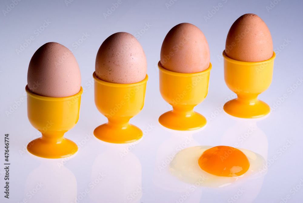 Four eggs in front of a broken one. Four eggs in front of a broken one.