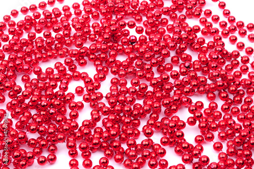 Red beads  Christmas decoration  isolated on white background