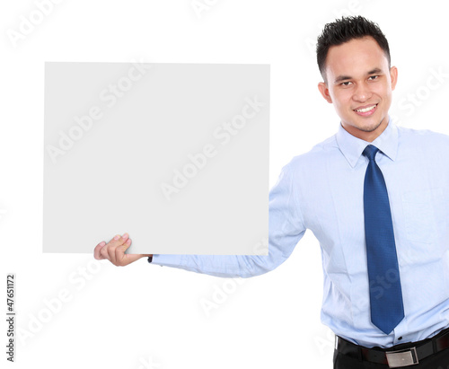 business man holding a blank billboard