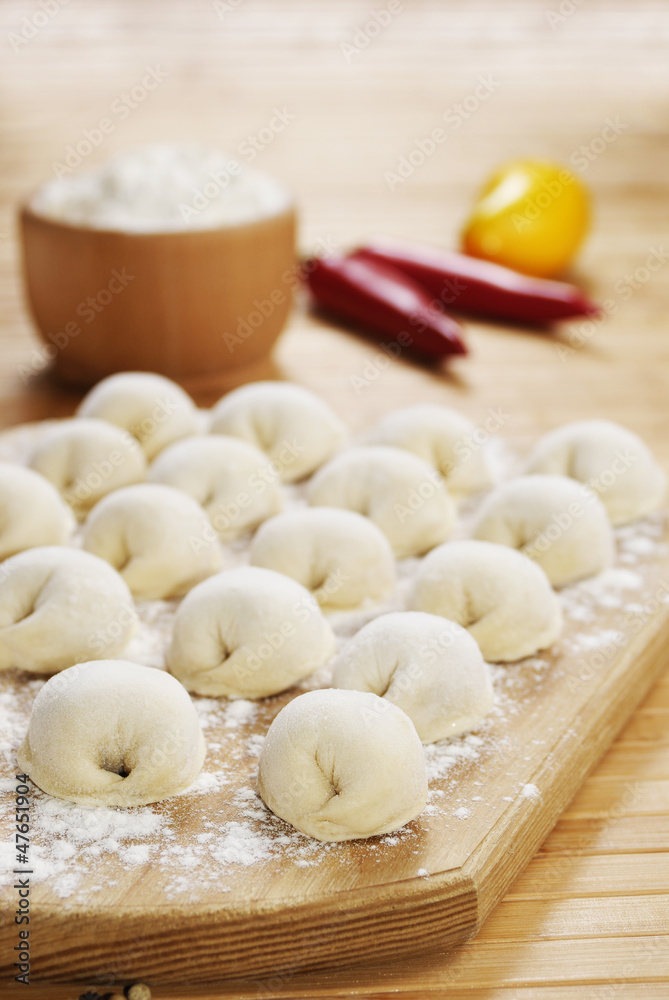 Meat dumplings on the kitchen board