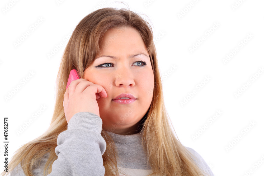 Young beautiful blonde woman speaks on mobile phone Young beautiful blonde woman speaks on mobile phone