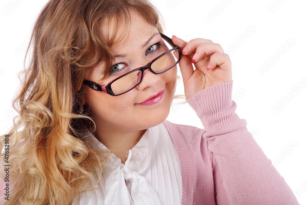 Smiling beautiful woman in glasses looks at camera isolated Smiling beautiful woman in glasses looks at camera isolated