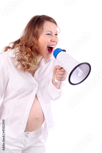 Pregnant woman in white shouts into megaphone isolated on white photo