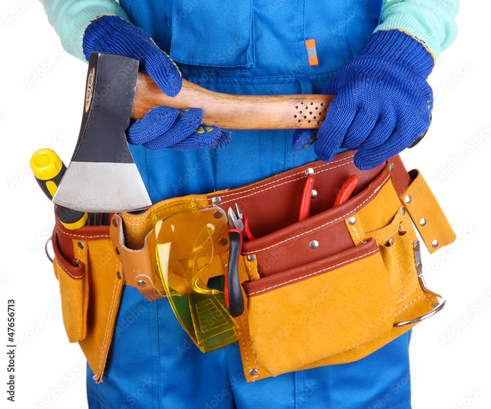 Male builder in blue overalls with hatchet isolated on white Male builder in blue overalls with hatchet isolated on white