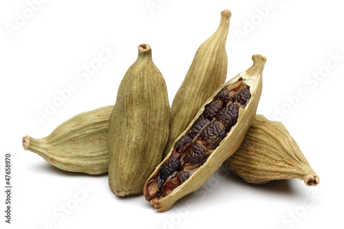 Cardamom seeds on a white background