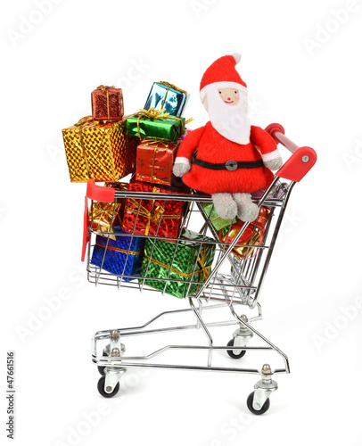 Shopping cart with Christmas gifts and presents. © xiaoliangge