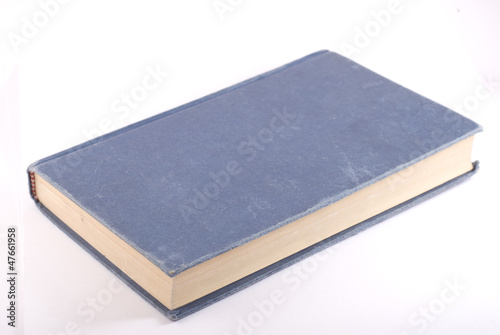 Old blue book isolated on white