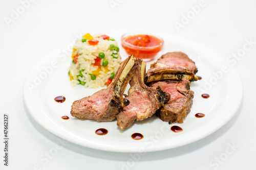 Grilled ribs with sauce and salad