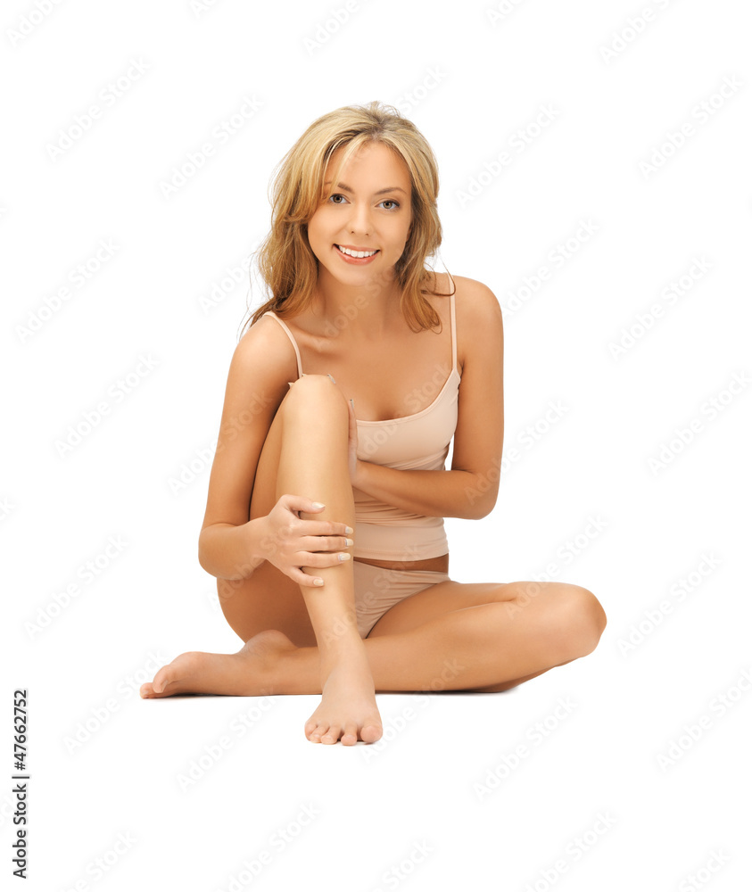 woman in cotton undrewear touching her legs woman in cotton undrewear touching her legs