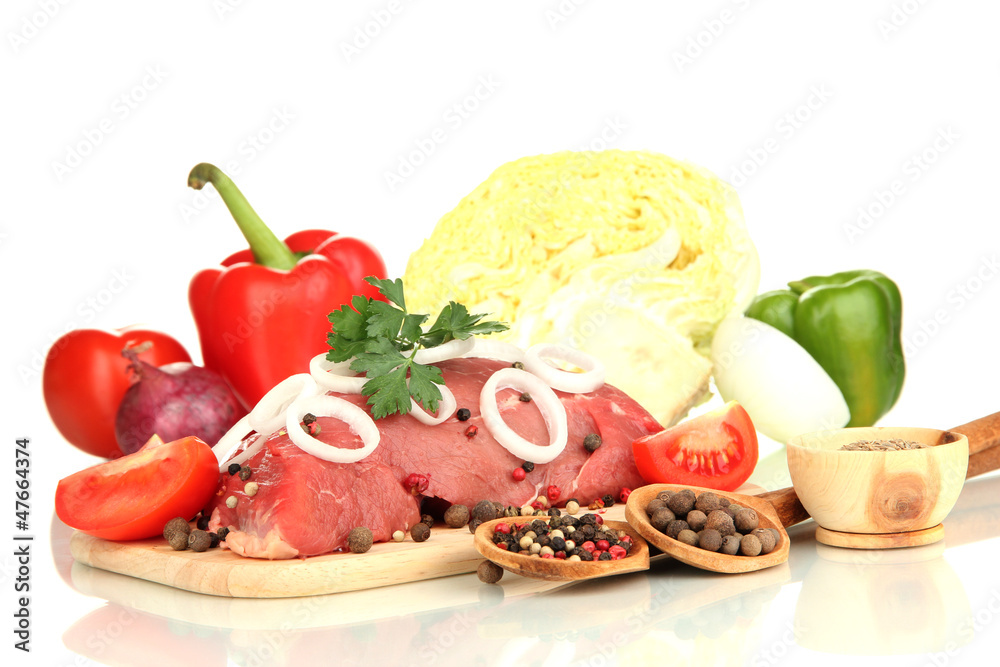 Raw beef meat with vegetables isolated on white