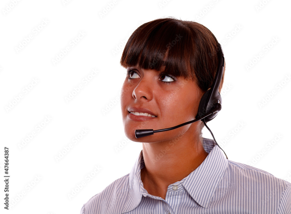 Pretty young woman with earphone looking up