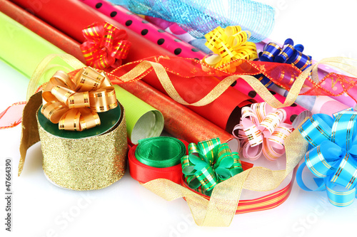 Rolls of Christmas wrapping paper with ribbons  bows isolated
