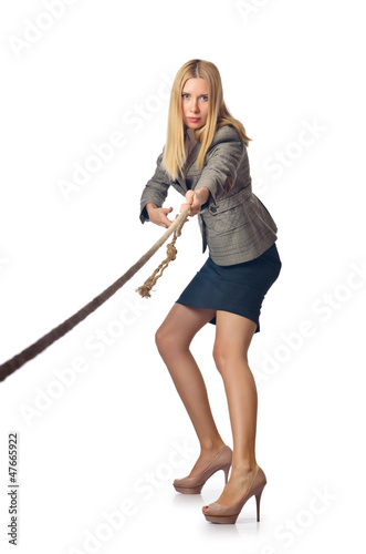 Businesswoman in tug of war concept