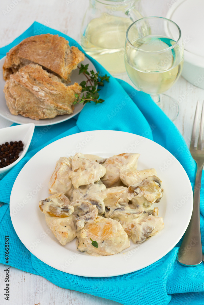 champignons with chicken on the white plate champignons with chicken on the white plate