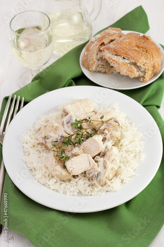chicken with champignons, sceams and boiled rice on the plate