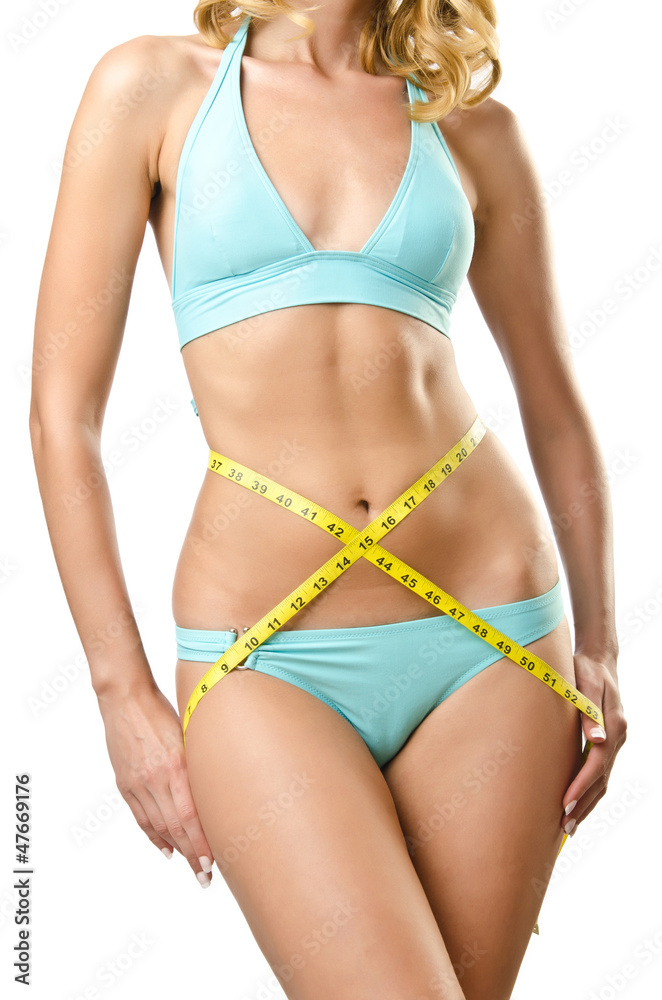 Woman in bikini in diet concept isolated on white Woman in bikini in diet concept isolated on white