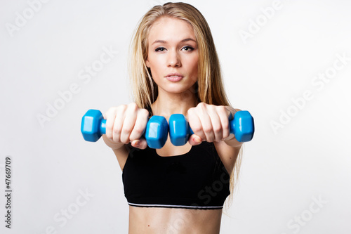 fitness woman working out with dumbbells
