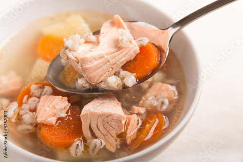 fish soup with salmon and orge perlé in spoon