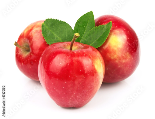 Sweet red apples with leafs