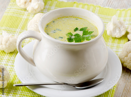 Creamy vegetables soup and cauliflowers
