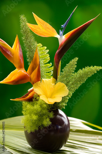 Hibiscus, Heliconia and Bird of Paradise flower in a vase.