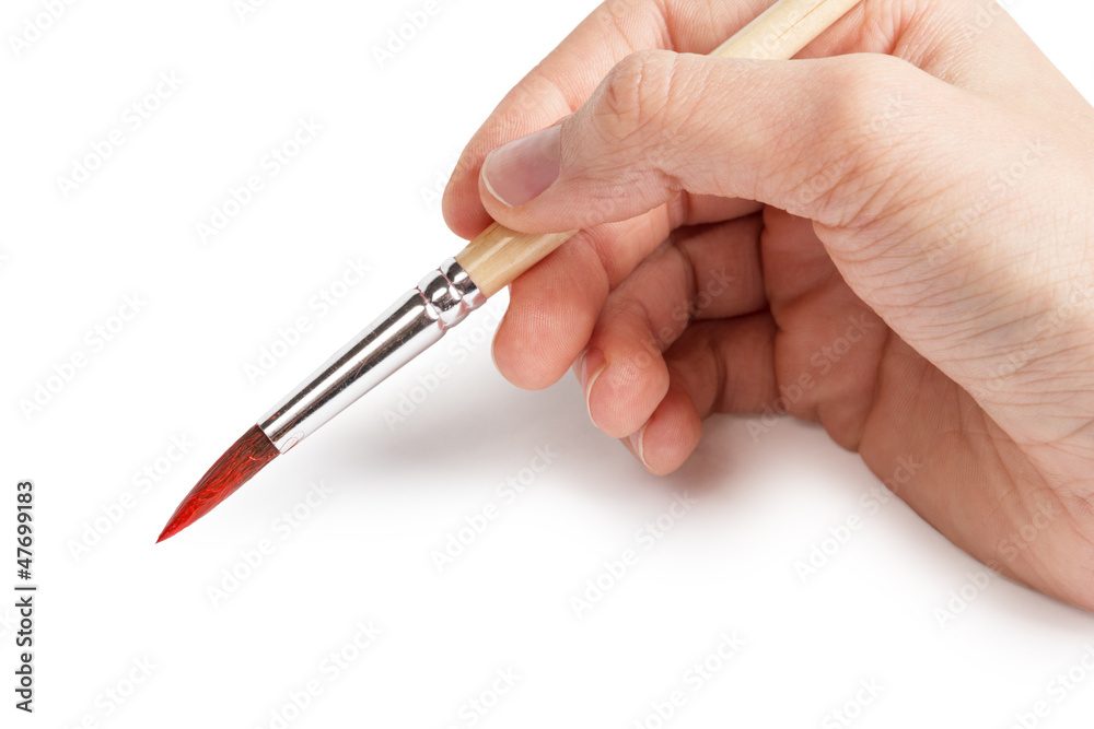 female teen hand with a brush