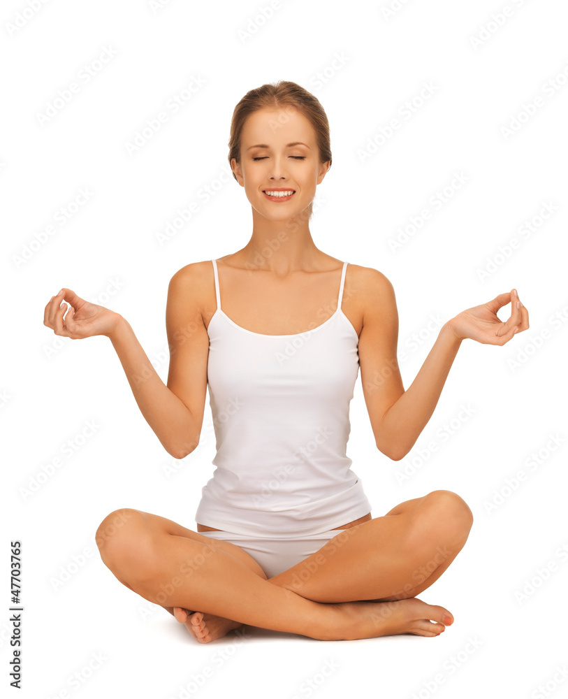 woman in undrewear practicing yoga lotus pose woman in undrewear practicing yoga lotus pose