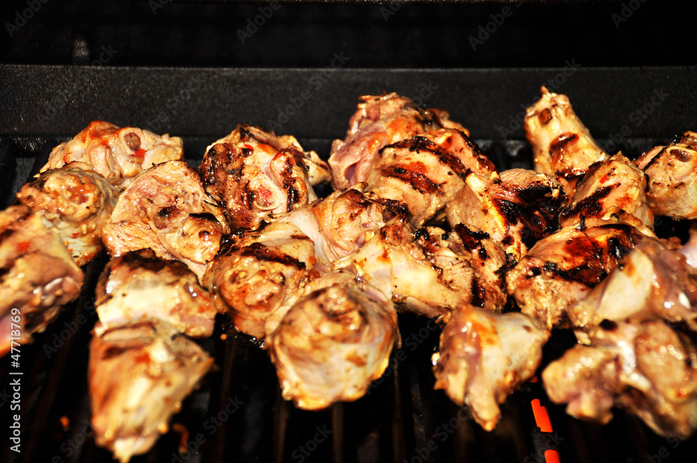 chicken parts on a grill