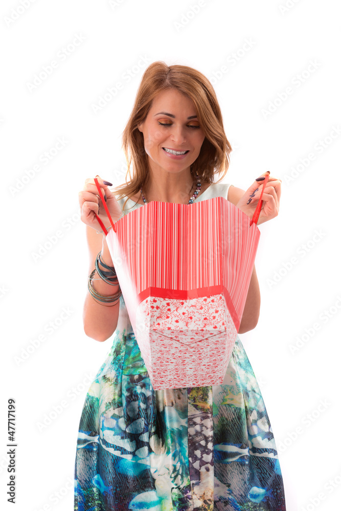 attractive woman holding shopping bags against a white backgroun attractive woman holding shopping bags against a white backgroun